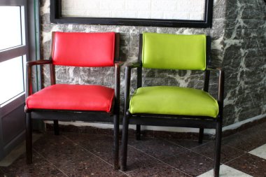 Chair and table in a cafe in a city park near the sea.