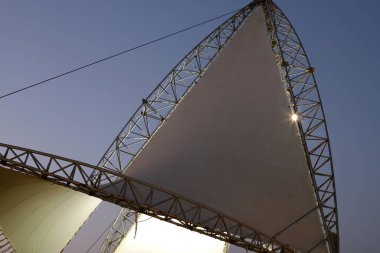 True sunlight and artificial lighting. Abstract photo of light and dark.