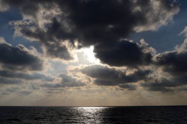 Rain clouds in the sky over the Mediterranean Sea.