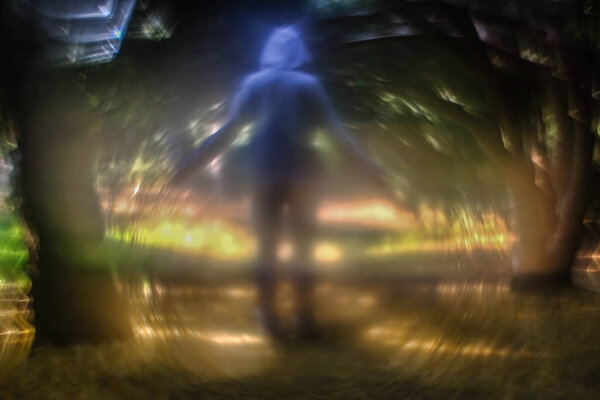 Background image of a forest, river, trees, and flowers with a special lens with a strong swirling effect.