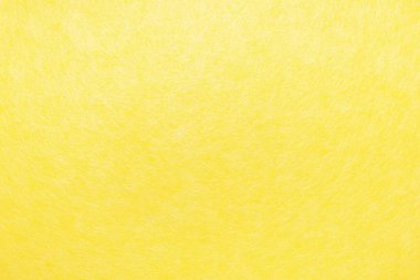 Beyaz liflerden oluşan örümcek ağlarıyla kaplı soyut sarı arkaplan.