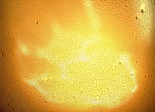 対照的な水滴でオレンジ色の透明背景を光る — ストック写真