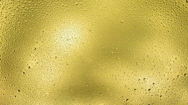 Karşıt su damlalarıyla parlayan sarı arkaplan.