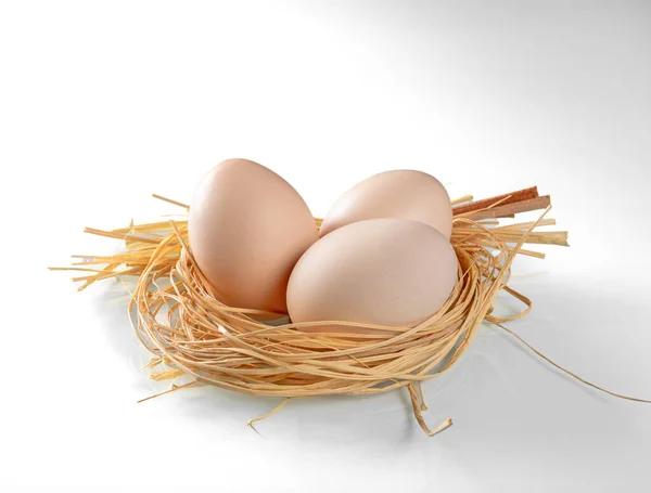 Three Chicken Eggs Nest Straw Close White Background — Stock Photo, Image