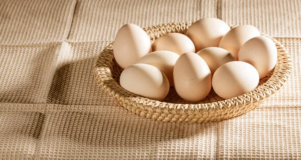 Chicken Eggs Straw Basket Background Waffle Towel Lit Morning Sun — Stock Photo, Image