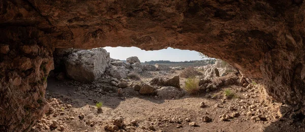 Exit from the cave where the primitive people lived in Tel Yodfat National park, in northern Israel