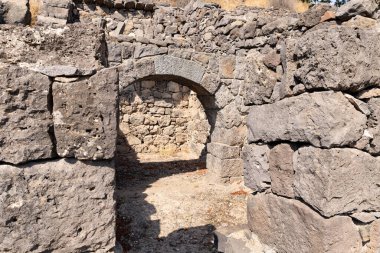 Remains of buildings and stone walls on the ruins of the Gamla city, Golan Heights, northern Israel clipart