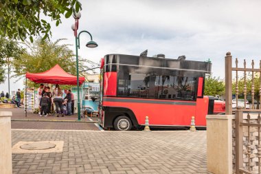 Ghajar, Israel, December 03, 2022 : Decorative cars with fast food on the main street in the Ghajar Alawite Arab village, located on the Golan Heights, on the border with Lebanon, in Israel
