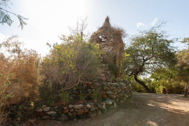 Eilat, Israel, December 13, 2022 : Decorative wicker wooden house on display at the Botanical Garden in the Eilat city, southern Israel