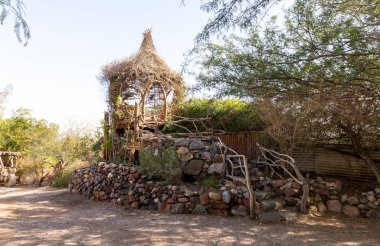 Eilat, Israel, December 13, 2022 : Decorative wicker wooden house on display at the Botanical Garden in the Eilat city, southern Israel