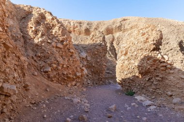 The dried up river bed - the path to the Red Canyon, in the national reserve - the Red Canyon in the rays of the setting sun, near the city of Eilat, in southern Israel.