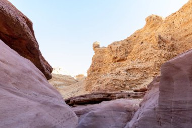 Fantastically beautiful landscape in the national nature reserve - Red Canyon in the rays of the setting sun, near the city of Eilat, in southern Israel