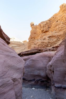 Fantastically beautiful landscape in the national nature reserve - Red Canyon in the rays of the setting sun, near the city of Eilat, in southern Israel
