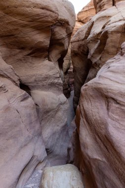 Fantastically beautiful landscape in the national nature reserve - Red Canyon in the rays of the setting sun, near the city of Eilat, in southern Israel
