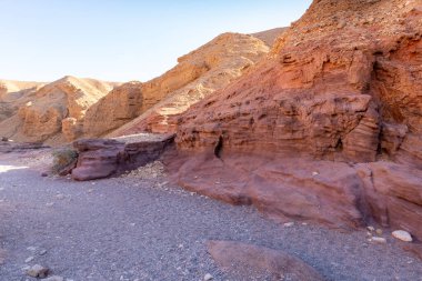 Fantastically beautiful landscape in the national nature reserve - Red Canyon in the rays of the setting sun, near the city of Eilat, in southern Israel