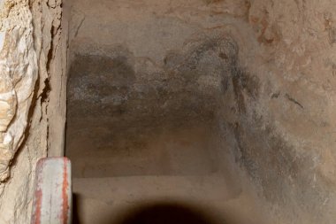The remains of a ritual Jewish bath - Mikvah in one of the buildings of the Masada fortress in the ruins of the Masada fortress, in southern Israel