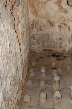 The remains of a Roman bath in one of the buildings of the Masada fortress in the ruins of the Masada - is a fortress built by Herod the Great on a cliff-top off the coast of the Dead Sea, in southern Israel