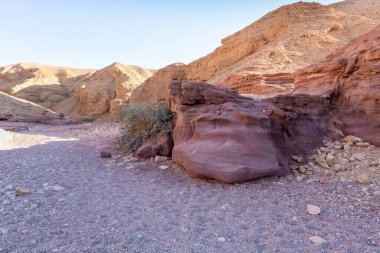 Fantastically beautiful landscape in the national nature reserve - Red Canyon in the rays of the setting sun, near the city of Eilat, in southern Israel