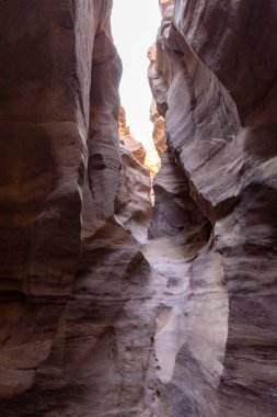 Fantastically beautiful landscape in the national nature reserve - Red Canyon in the rays of the setting sun, near the city of Eilat, in southern Israel