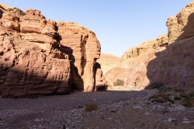 Fantastically beautiful landscape in the national nature reserve - Red Canyon in the rays of the setting sun, near the city of Eilat, in southern Israel