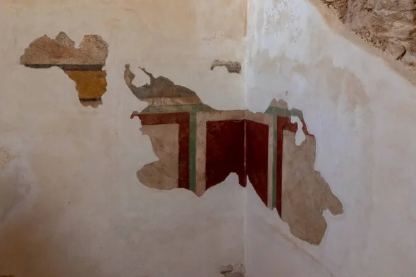 Remains of paintings on the walls of internal buildings in the ruins of the Masada - is a fortress built by Herod the Great on a cliff-top off the coast of the Dead Sea, in southern Israel