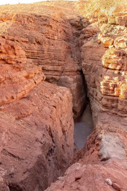 Fantastically beautiful landscape in the national nature reserve - Red Canyon in the rays of the setting sun, near the city of Eilat, in southern Israel