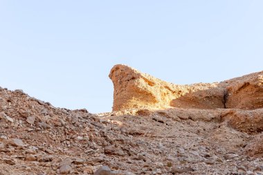 Fantastically beautiful landscape in the national nature reserve - Red Canyon in the rays of the setting sun, near the city of Eilat, in southern Israel