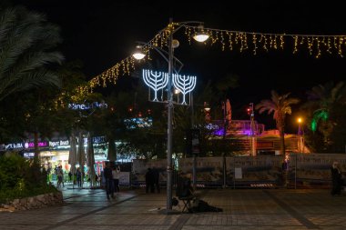 Eilat, Israel, December 13, 2022 : Night view of the ornate promenade on the waterfront in the center of Eilat city in southern Israel