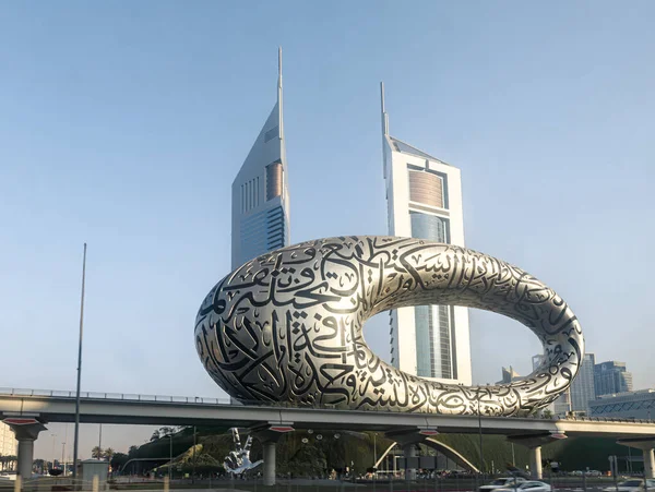 stock image Dubai, United Arab Emirates, March 16, 2023 : View from the window of a tourist bus to the Museum of The Future and the Jumeirah Emirates Towers in Dubai city, United Arab Emirates