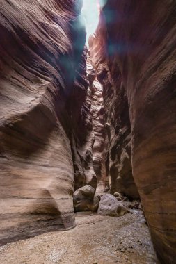 A small shallow stream flows along a hiking trail in the Wadi Numeira gorge in Jordan