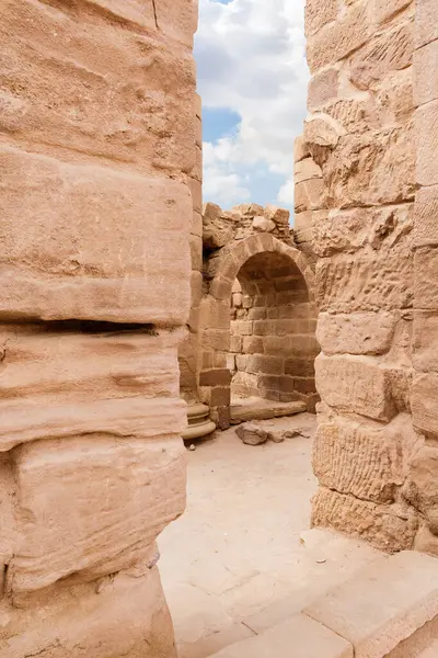 Arched  passage on one of the streets of the Roman city in the Nabataean Kingdom of Petra in the Wadi Musa city in Jordan