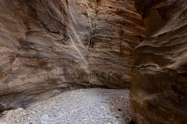 Bizarre  natural patterns on mountain walls on the tourist route of the gorge Wadi Al Ghuwayr or An Nakhil and the wadi Al Dathneh near Amman in Jordan