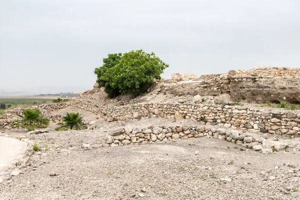 stock image Remains of stone walls of city buildings at the excavation of the Canaanite Fortifications of the Megiddo site near the Yokneam city in the northern Israel