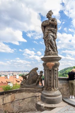 Prague, Czech Republic, May 12, 2024 : The statue of St Philip Neri stands on Hradcany Square next to Prague Castle and the Castle Stairs of Prague in the Czech Republic clipart