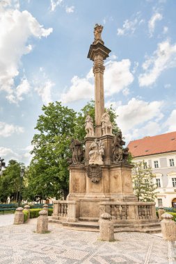 Prague, Czech Republic, May 12, 2024 : The Marian Plague Column in the garden on Hradcanska Square in Prague in Czech Republic clipart