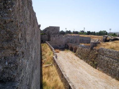 A well preserved moat between fortress walls in historic part of Rhodes city on Rhodes island in Greece clipart