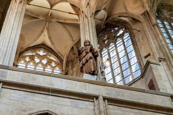 Kutna Hora, Czech Republic, May 13, 2024 : The statue on upper floor balcony in St Barbara Cathedral in Kutna Hora city in Czech Republic