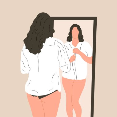 Beautiful plus size woman looking in mirror at home.