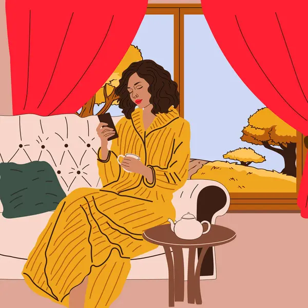 Kız pencerenin yanındaki kanepede sonbahar manzaralı oturuyor. Sonbahar sezonu. Hygge konsepti. Sıcak sonbahar günleri