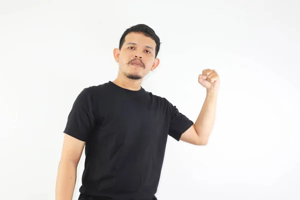 stock image a man clenched his fists and showed a fierce and straight face, isolated on white background