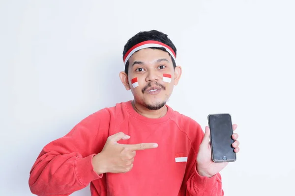 Portrait Smiling Asian Man Wearing Headband Showing His Phone Isolated — Stock Photo, Image