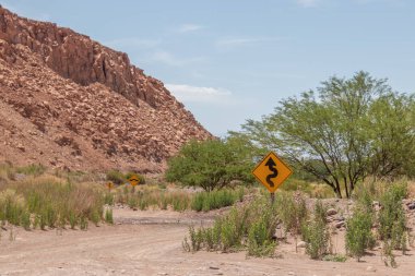 Road signals in the middle of Garganta del Diablo valley in Atacama, the most arid desert of the world in Chile