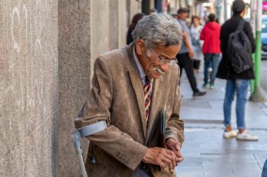 Valparaiso, Chile - Dec 5, 2022: Senior man standing on a central street in Valparaiso, Chile