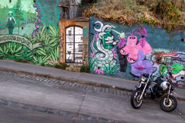 Valparaiso, Chile - Dec 5, 2022: Gaffiti on a steep street of a poor area of Valparaiso, which has been declared as a World Heritage Site by UNESCO