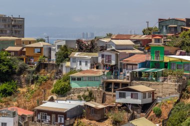Valparaiso, Chile - Dec 5, 2022: Colorful houses in a poor neighborhood of Valparaiso, which has been declared as a World Heritage Site by UNESCO
