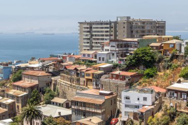 Valparaiso, Chile - Dec 5, 2022: Colorful houses in a poor neighborhood of Valparaiso, which has been declared as a World Heritage Site by UNESCO