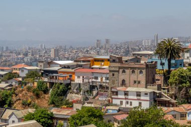 Valparaiso, Chile - Dec 5, 2022: Colorful houses in a poor neighborhood of Valparaiso, which has been declared as a World Heritage Site by UNESCO