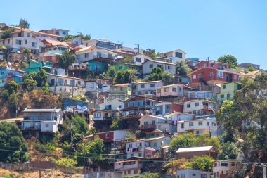 Valparaiso, Chile - Dec 5, 2022: Colorful houses in a poor neighborhood of Valparaiso, which has been declared as a World Heritage Site by UNESCO