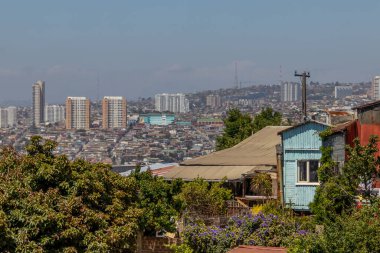 Valparaiso, Chile - Dec 5, 2022: Colorful houses in a poor neighborhood of Valparaiso, which has been declared as a World Heritage Site by UNESCO