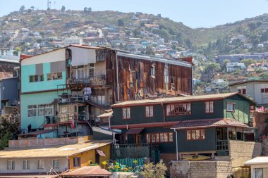 Valparaiso, Chile - Dec 5, 2022: Colorful houses in a poor neighborhood of Valparaiso, which has been declared as a World Heritage Site by UNESCO